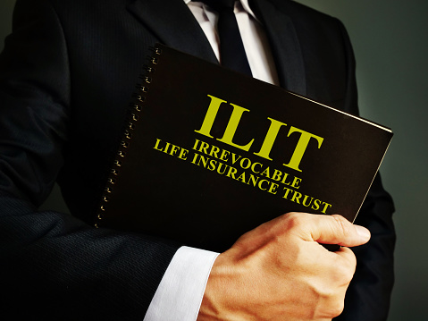 Man holds Irrevocable Life Insurance Trust ILIT policy.