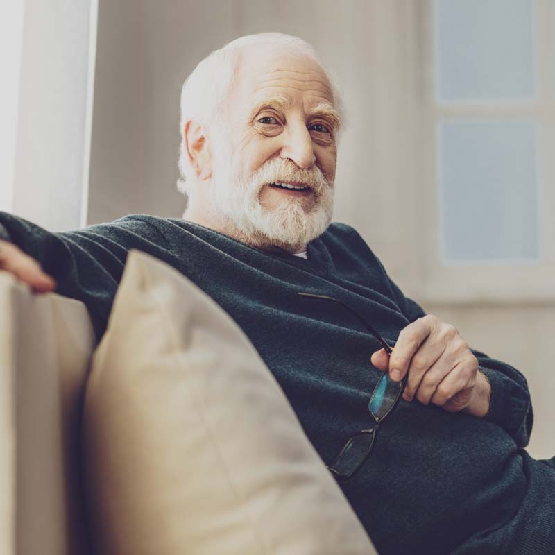 Elderly man on couch